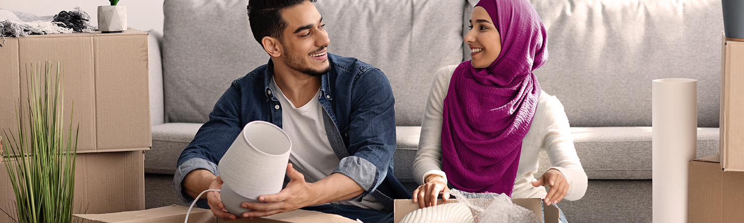 couple packing their belongings and moving