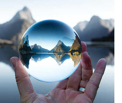 looking at a lake and mountain from a crystal ball